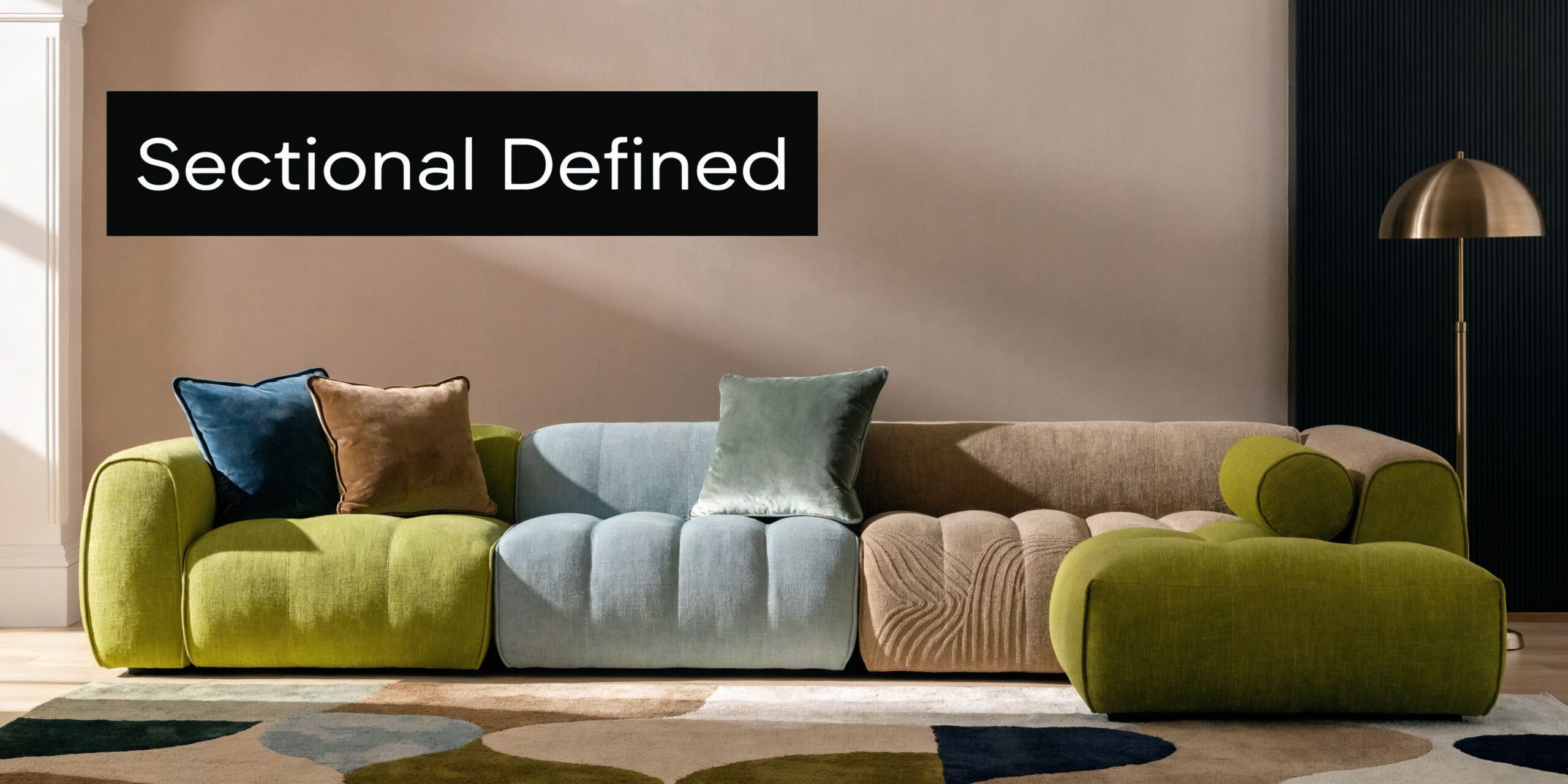 A modern colorful four-piece sectional sofa with decorative pillows arranged in a bright, stylish contemporary living room.