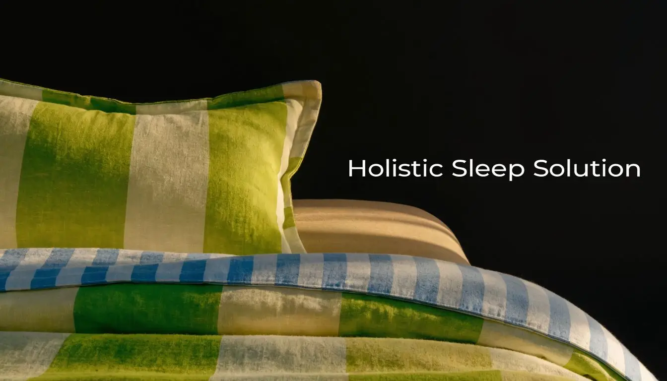 A soft green and beige striped pillow rests on a bed with matching checkered bedding.